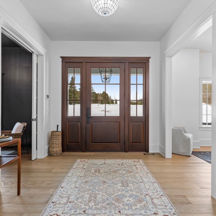 Front foyer with statement large mahogany door